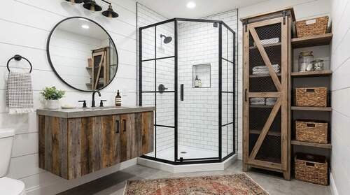 Small modern farmhouse bathroom layout with a floating vanity, glass shower, and space-saving storage