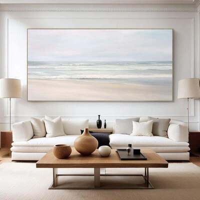 Rustic coastal living room with a weathered wood coffee table and relaxed linen sofa.